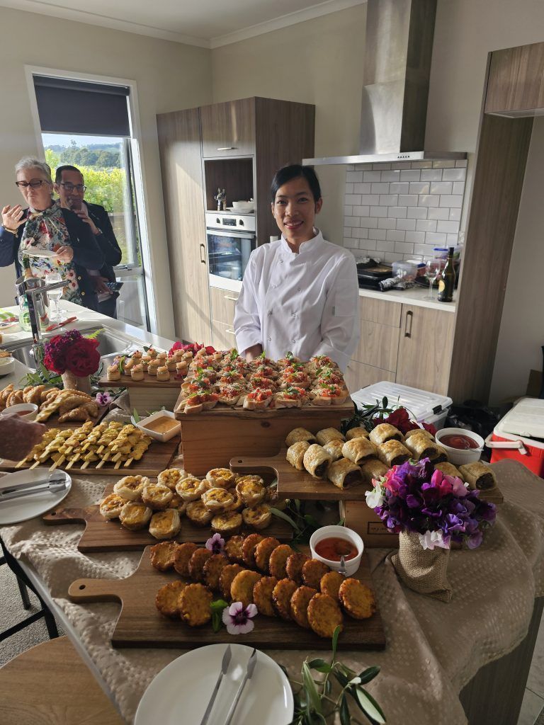 chef siri at birthday event with boards of appetizers