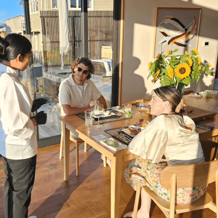 photo of chef siri serving food to private clients at their home