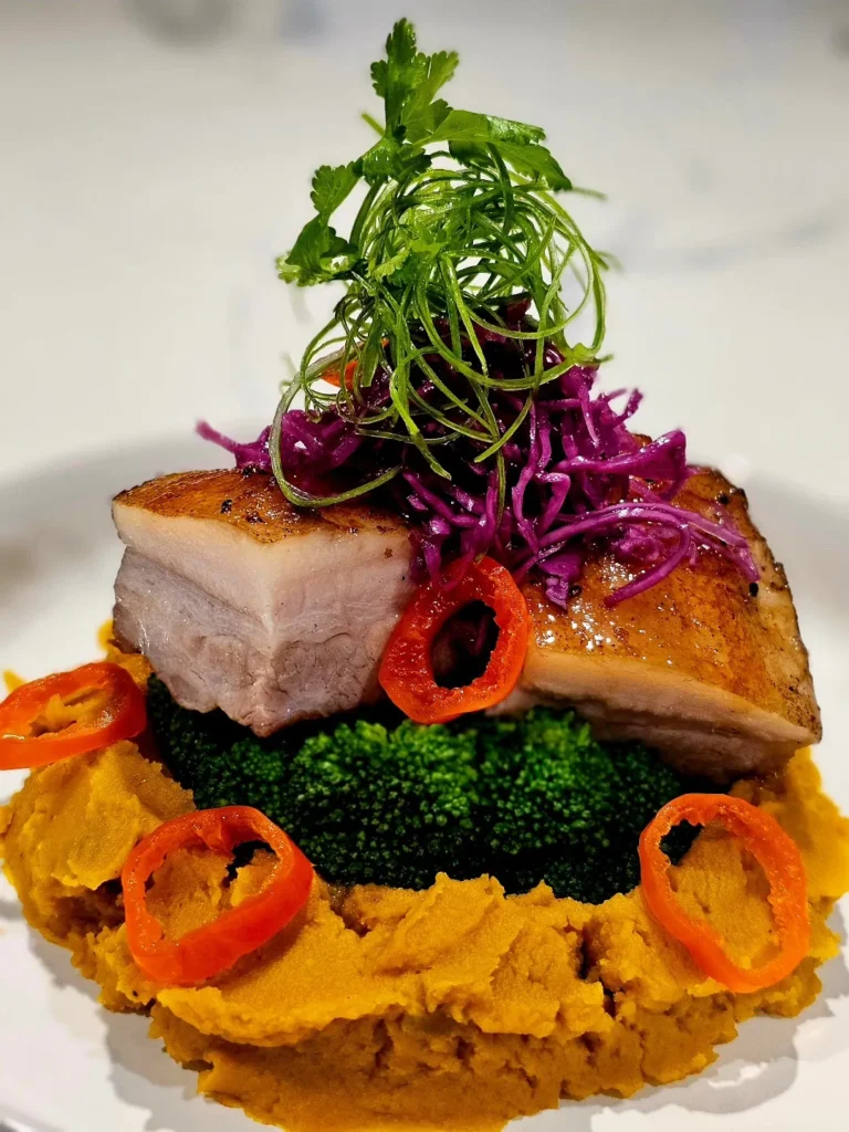 crispy-pork-belly-pumpkin-puree-broccoli-pickled-cabbage-gourmet-plating
