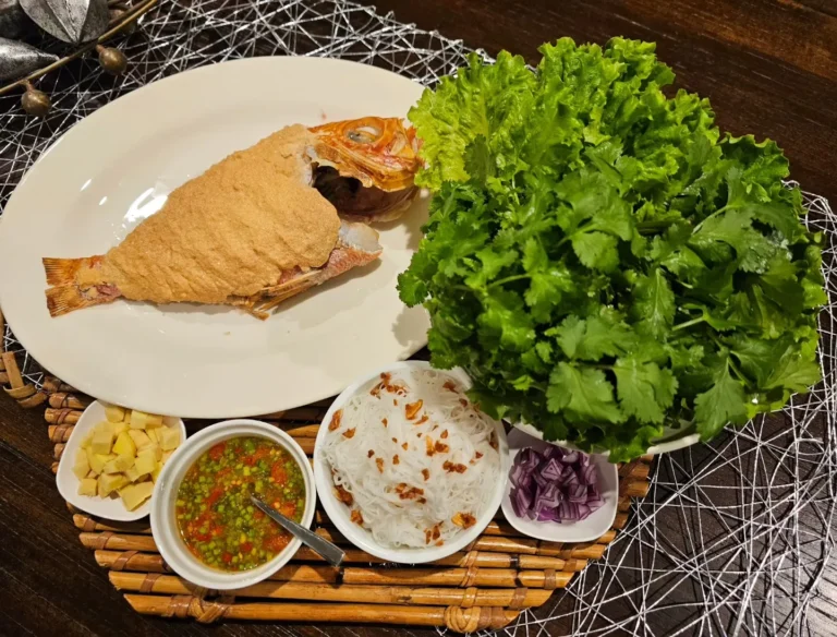 crispy whole fried fish with fresh herbs vermicelli and dipping sauce