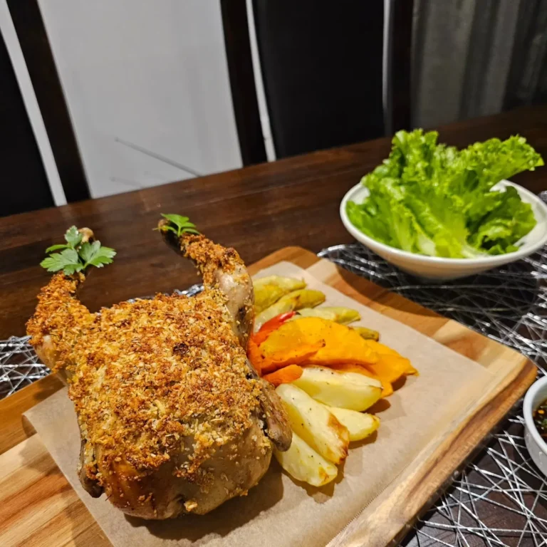 herb crusted roast chicken with seasonal vegetables and crispy potatoes