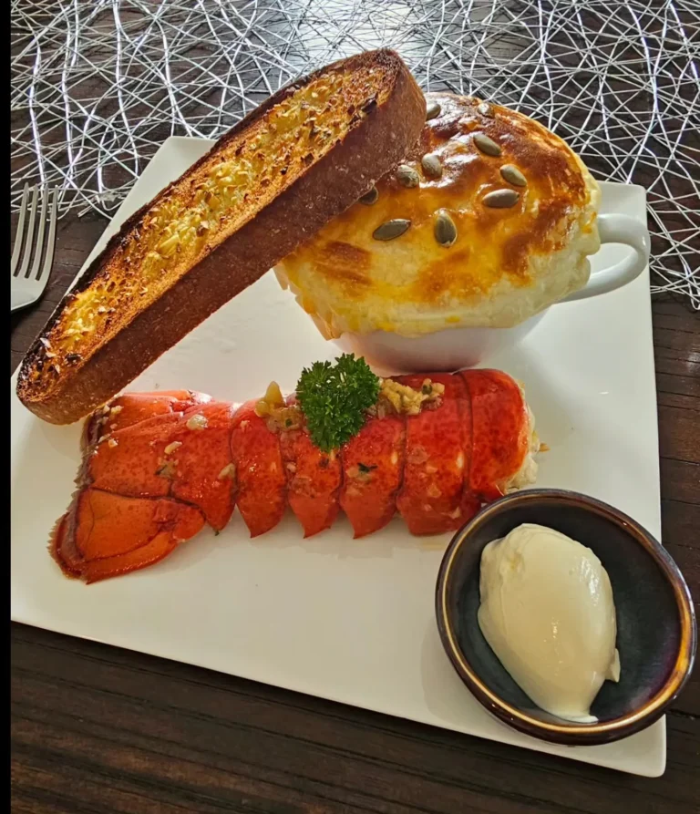 lobster tail with creamy pie garlic bread and herb butter