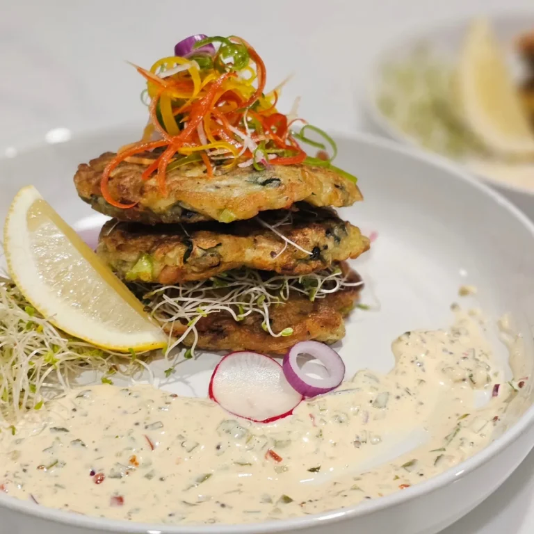stacked-seafood-fritters-creamy-sauce-microgreens-gourmet-plate