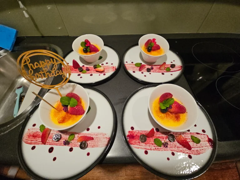 creme-brulee-birthday-dessert-plates-strawberries-berry-coulis-happy-birthday-topper