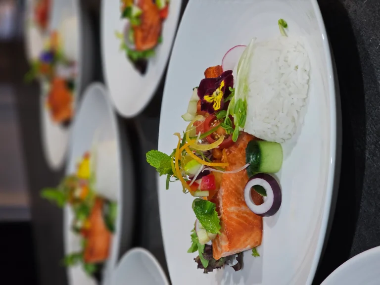 pan-seared-salmon-fillet-steamed-rice-edible-flower-plated-dish
