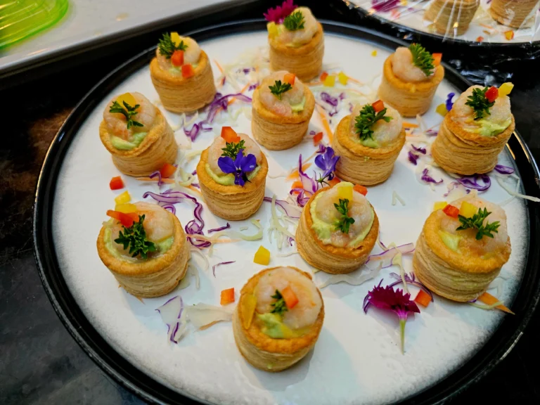 prawn-vol-au-vents-avocado-cream-round-platter-edible-flowers-canapés