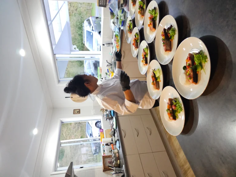 private-chef-plating-salmon-dishes-rural-home-kitchen-dinner-service